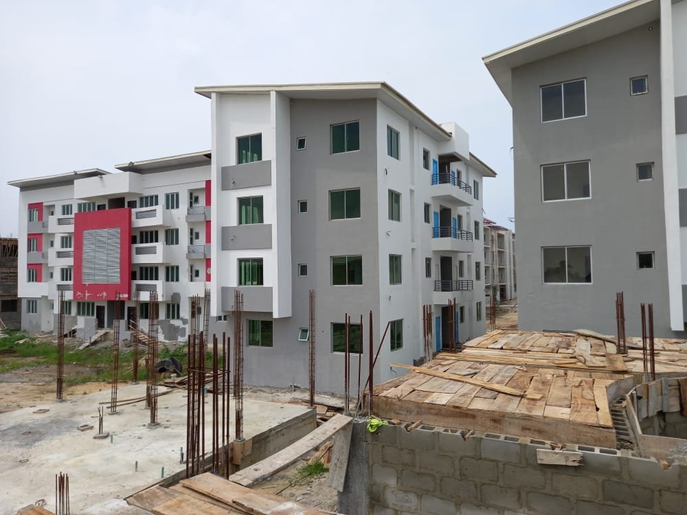 Estate blocks at finishing stage with reinforcement bars in the foreground